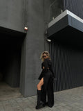 Set top e pantaloni con spacchi nero