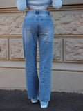 Jeans vita bassa con strappi laterali