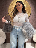 Jeans con pizzo e perle