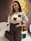 Maglione con fiocchi