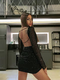 Abito nero con paillettes schiena aperta