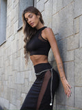 Completo top e gonna nero con trasparenze