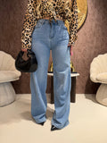 Jeans con tasca glitter maculata