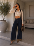 Jeans wide leg con dettagli maculati