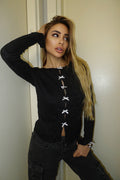 Maglia nera con fiocchetti