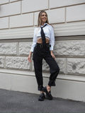 Pantalone nero con cinghie