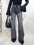 Jeans scuro con strass e risvolto