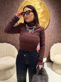 Maglioncino collo alto a righe spalle bombate