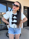 Giacca crop con fiocchi bianco nero