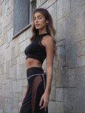 Completo top e gonna nero con trasparenze