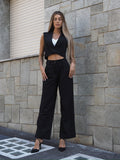 Completo smanicato e pantalone gessato nero