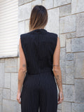 Completo smanicato e pantalone gessato nero