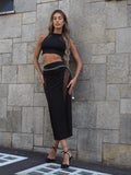 Completo top e gonna nero con trasparenze