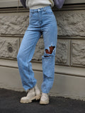 Jeans chiaro con strappi