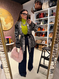 Jeans con borchie laterali