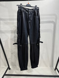 Pantalone in ecopelle con frange