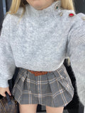 Pull grigio con bottoni gioiello