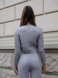 Completo maglia e pantalone grigio a righe