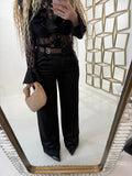 Pantalone con fibbia laterale