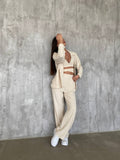 Set tre pezzi camicia top e pantalone beige