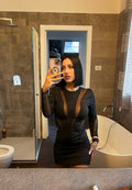 Abito nero con trasparenze