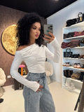 Blusa monospalla drappeggiata