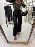 Pantalone in ecopelle con frange