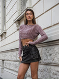 Maglione malva a trecce