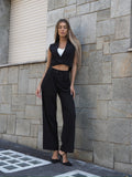 Completo smanicato e pantalone gessato nero