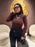 Maglioncino collo alto a righe spalle bombate