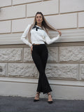 Maglione panna con fiocco nero