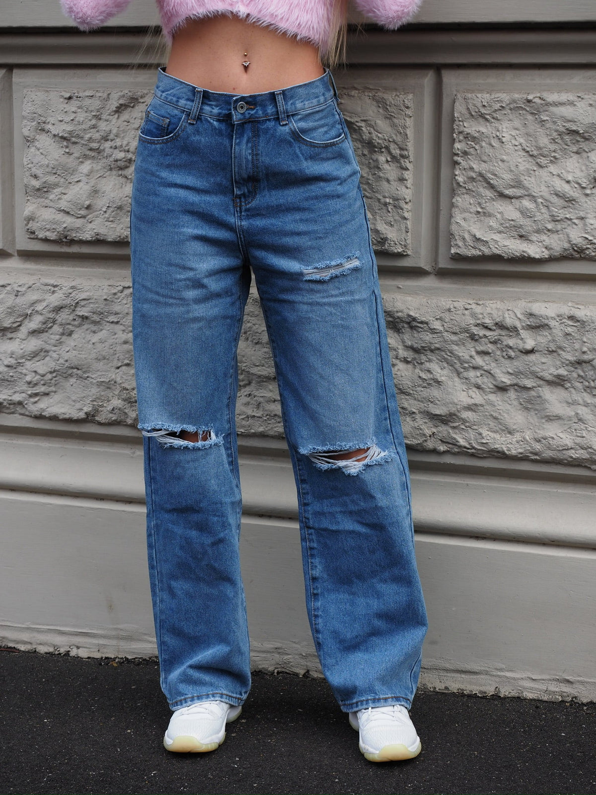 Jeans vita bassa con strappi