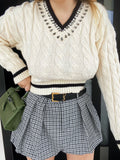 Maglione bianco e nero con strass