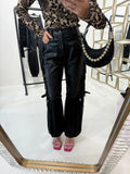 Pantalone in ecopelle con frange