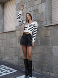Maglione a righe spalline in strass