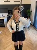 Maglione/ cardigan bianco nero con bottoni