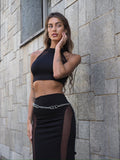 Completo top e gonna nero con trasparenze