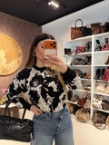 Felpa Cow print con lucchetto