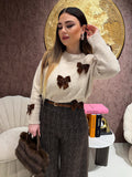 Maglione con fiocchi