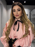 Camicia rosa con fiocco