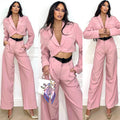 Tailleur giacca e pantalone rosa con dettaglio nero in pizzo