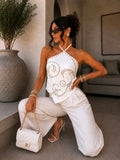 Top corsetto con borchie arabesque