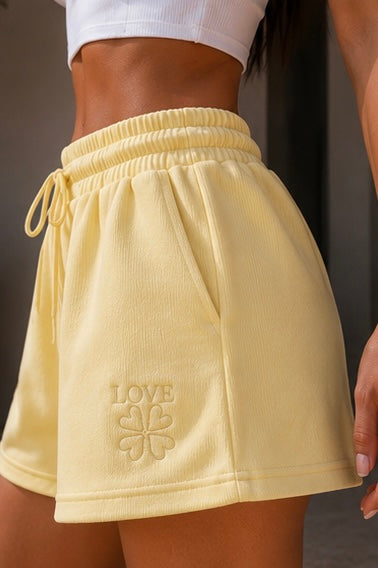 Short con scritta Love