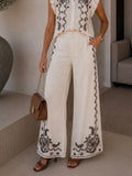Completo Camicia pantaloni con ricami bianca