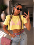 T-shirt cropped gialla con spalline imbottite