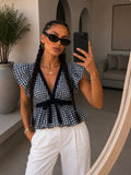 Top vichy con volant e fiocco bianco e blu