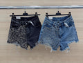 Jeans nero con borchie