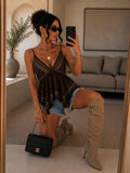 Top marrone con borchie e ricami geometrici