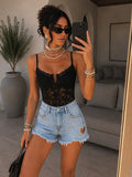 Short in jeans con cuore in strass