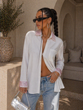 Camicia con brillantini su polso e maniche